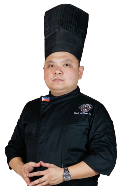Chef in black uniform and hat, arms crossed, with Philippine flag patch.